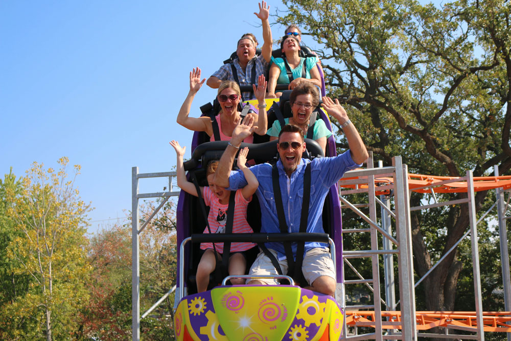 Guests Ride Super Cyclone Roller Coaster